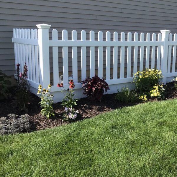Murton white vinyl picket fence with wildflower garden