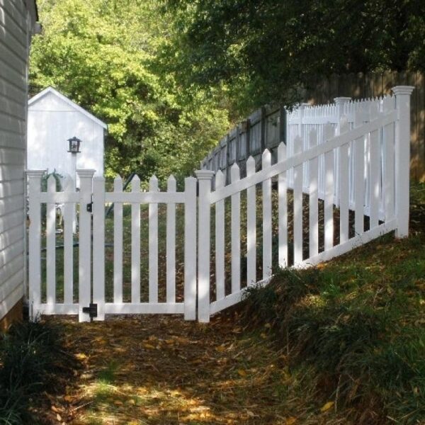 Murton white vinyl picket fence stair panel on a slope