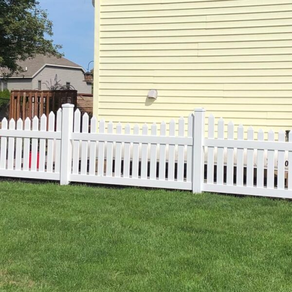 Rochdale white vinyl picket fence yellow house
