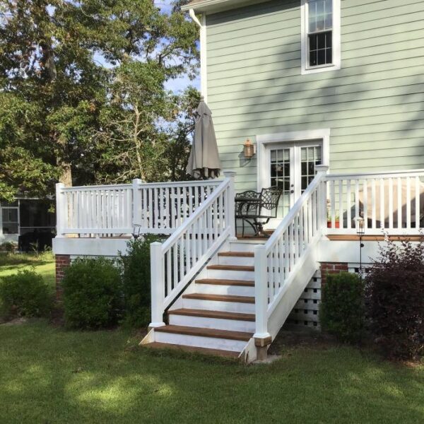 Harrington White vinyl railing on green house