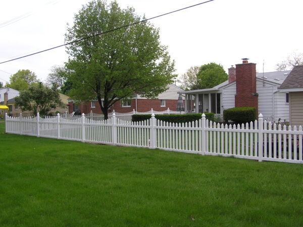 Darlington White vinyl picket fence in a yard