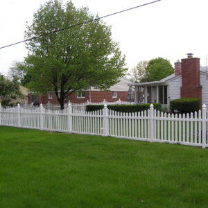 Darlington white vinyl picket fence in grass