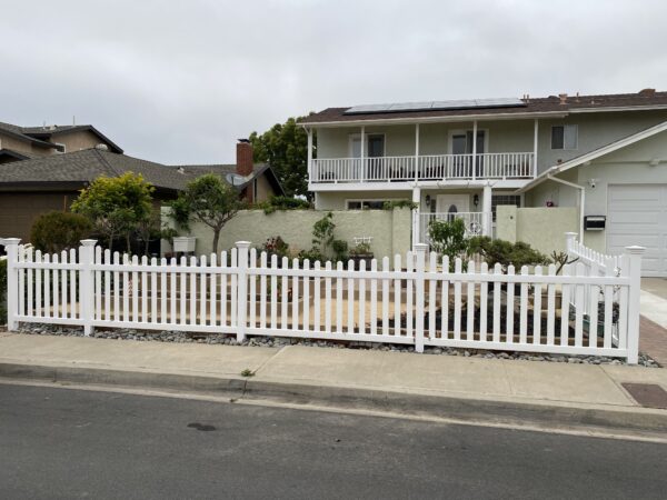 Darlington White vinyl picket fence along a sidewalk