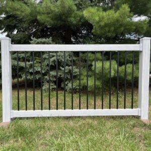 amherst coastal grey woodgrain vinyl railing in the grass