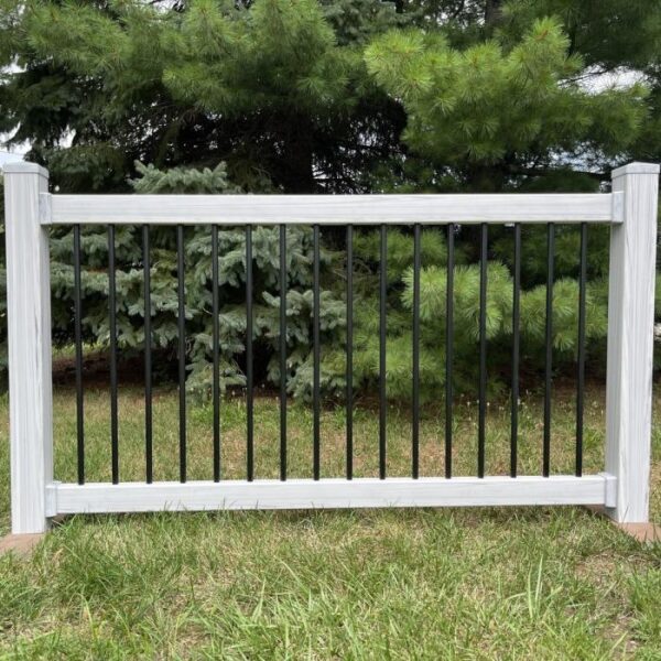 amherst coastal grey woodgrain vinyl railing in the grass